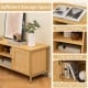 Boho TV stand with faux rattan door, spacious tabletop for TVs up to 55 inches, and ample storage with 2 cabinets and.