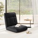 Black folding floor chair with adjustable backrest, ideal for gaming, reading, or napping in a modern living space.