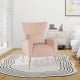 Pink velvet upholstered wingback chair with lumbar pillow and golden metal legs, perfect for living rooms and bedrooms.