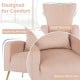 Velvet upholstered wingback chair in pink with ergonomic armrests and lumbar pillow, perfect for living rooms and.