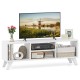 Media TV console table in white with raised support legs, featuring open compartments for storage and a modern design.