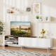 Farmhouse TV stand in white for TVs up to 80 inches, featuring open compartments and a flip-over cabinet for storage.