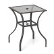Square outdoor patio table with rattan edging, 28.5 inches, glass top, suitable for indoor and outdoor use.