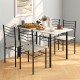 Natural wood and metal dining table set featuring four stylish chairs, ideal for casual dining and gatherings.