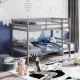 Twin size gray wooden bunk bed with ladder and safety rail, perfect for compact spaces and family use.