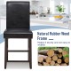 Black bar stool with soft padded seat, 25" height, made of durable rubber wood for kitchen or cafe use.