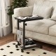 C-shaped rolling height adjustable side table with black finish, perfect for snacks and books beside a sofa.
