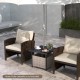Gray outdoor patio rattan wicker side table with umbrella hole, featuring a sturdy steel frame for all weather.
