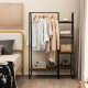 Clothes rack with a sleek metal design, showcasing 4 small shelves for shoes and bags alongside a hanging rod for.