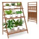 3-tier brown bamboo ladder shelf with plants, foldable design for indoor and outdoor use, durable and stable structure.