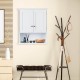 Wall-mounted white bathroom cabinet with two doors and adjustable shelves for organized storage in any room.