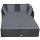 Spacious outdoor rattan daybed in gray with upholstered cushions, featuring armrests and a curved backrest for comfort.