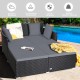 Spacious outdoor rattan daybed with gray upholstered cushions, supporting up to 800 lbs for comfortable lounging.