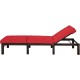 Adjustable outdoor rattan chaise lounge with red cushion, sturdy steel frame, ideal for patio and poolside relaxation.