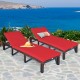 Adjustable outdoor rattan chaise lounge with red cushions, perfect for poolside or patio relaxation.