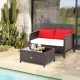 Wicker loveseat set with red cushions and coffee table, featuring hand-woven PE rattan for outdoor use by the poolside.