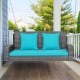 Two-person patio PE wicker hanging swing bench with turquoise cushions, featuring sturdy chains and ergonomic armrests.