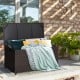 Outdoor wicker storage box with zippered liner, 50-gallon capacity, placed on patio, ideal for backyard organization.