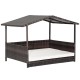 Outdoor wicker dog house with weatherproof roof and soft cushion, ideal for yard or garden use.