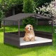 Outdoor wicker dog house with weatherproof roof and soft cushion, perfect for yard or garden use.