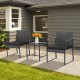 Two black armchairs with soft cushions and a glass-top coffee table in a modern patio setting for outdoor relaxation.
