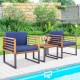 Acacia wood patio conversation set with navy cushioned armchairs and coffee table, perfect for outdoor relaxation.