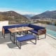 8-piece patio dining set featuring acacia wood table and navy cushions, perfect for outdoor relaxation by the poolside.