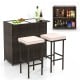 Patio bar set featuring a tempered glass tabletop, brown PE rattan, and two cushioned stools for indoor and outdoor use.