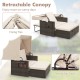 Outdoor patio rattan daybed with beige retractable canopy and adjustable backrests, perfect for backyard relaxation.