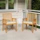 Two acacia wood patio dining chairs with removable cushions, perfect for outdoor bistro conversations on the porch.