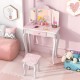 Kids vanity set in pink with tri-folding mirror, storage drawer, and makeup accessories for organized playtime.