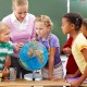 Illuminated world globe with stand, showcasing geographical and constellation maps, ideal for educational use and.