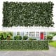 Artificial lily leaf privacy fence in a garden setting, made of durable polyester for year-round decor and privacy.