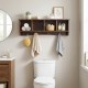 Wall-mounted brown storage shelf with four compartments and five hooks, ideal for organizing coats and sundries.