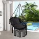 Hanging hammock chair in black with soft cushions, tassels, and sturdy rope chain, perfect for indoor or outdoor use.