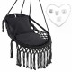 Hanging hammock chair in black with soft cushions, tassels, and sturdy rope chain, suitable for indoor and outdoor use.