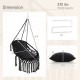 Hanging hammock chair in black with soft cushions, sturdy rope chain, and elegant tassels for indoor or outdoor use.