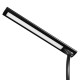 Black swing-arm lamp included with the deluxe steel-frame manicure table, ideal for upscale salon lighting.