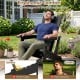 Black HDPE outdoor Adirondack chair with curved backrest and built-in cup holder, ideal for comfortable patio relaxation.