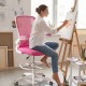 Height adjustable drafting chair in pink with flip-up arms, ergonomic backrest, and breathable mesh for home office use.