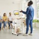 Height adjustable mobile computer stand-up desk with wheels, perfect for presentations and small spaces, shown in use.