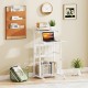 Height adjustable mobile computer stand-up desk in white with wheels, featuring a top shelf and bottom storage for.