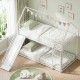 House-shaped metal twin over twin low bunk bed in white with slide, safety guardrails, and decorative details for kids.