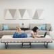 Folding guest bed with memory foam mattress, 75 x 31.5 inches, ideal for living room or office use, shown in a cozy.