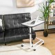 Rolling overbed bedside table with adjustable height, white tabletop, and C-shaped frame for easy positioning near a.