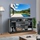 58-inch black TV stand with adjustable open shelves, perfect for organizing media and enhancing modern home decor.