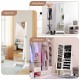 Standing jewelry armoire cabinet with full-length mirror in white, featuring ample storage for jewelry and cosmetics.