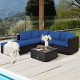 L-shaped outdoor patio rattan sofa set with blue cushions and glass-top coffee table, ideal for garden or poolside.