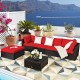 Red 6-piece outdoor patio rattan sofa set with ottoman and coffee table, perfect for garden or poolside relaxation.