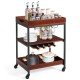 Three-tier kitchen serving cart featuring a wooden surface, wine rack, and glass holder, perfect for easy kitchen.
